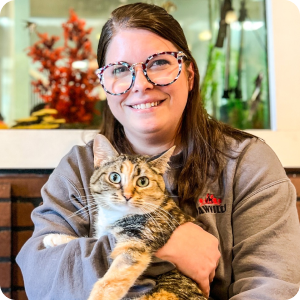 Employee holding a cat